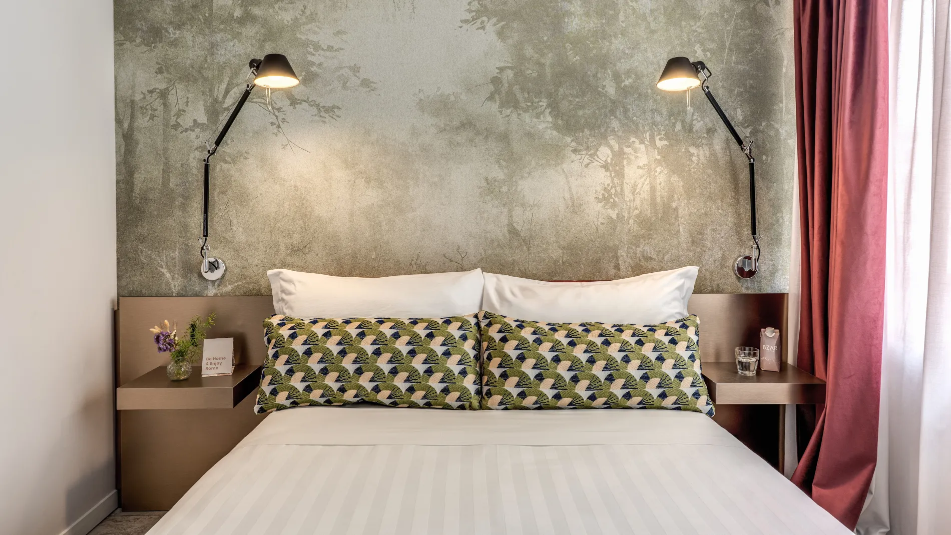 Double bed detail with geometric cushions and reading lights in design Junior Suite in Rome - Barberini 16, BZAR hotels in Rome