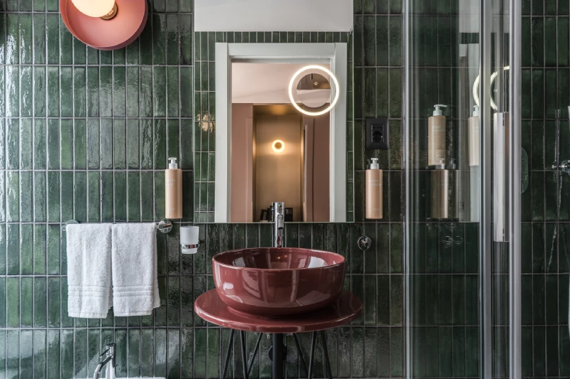 Deluxe bathroom detail with designer sink, illuminated mirror and shower near Palazzo Barberini Rome - Barberini 16, BZAR hotels in Rome