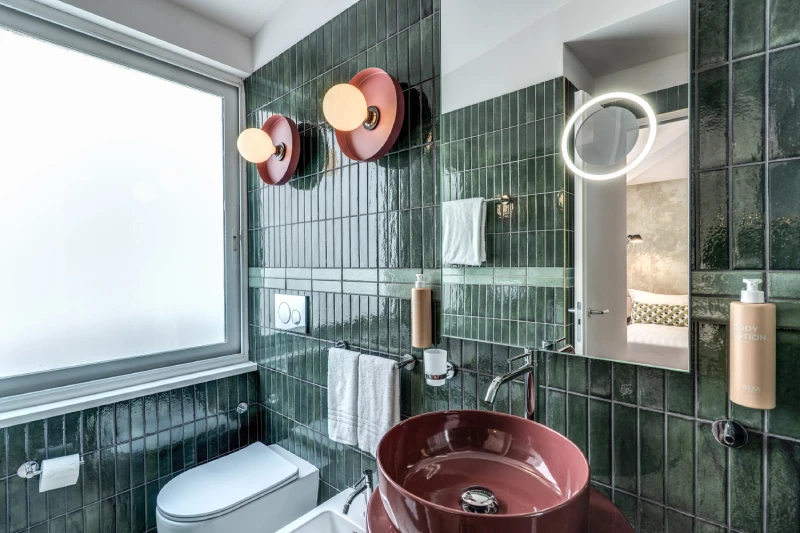 Stylish bathroom with designer sink, illuminated mirror and window near Palazzo Barberini in Rome - Barberini 16, BZAR hotels in Rome